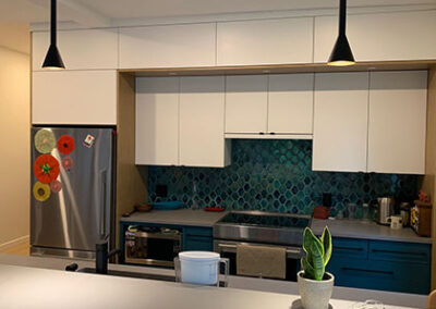 Newly renovated kitchen with island, green backsplash